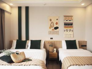 Darley Hotel Chiangmai客房内的一张或多张床位