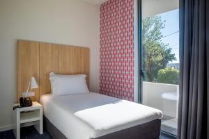 Stay Hotel Lisboa Aeroporto客房内的一张或多张床位