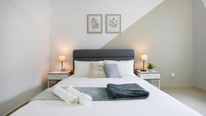 Desaru Minimalism Muji Style by Joyfully 35M7客房内的一张或多张床位