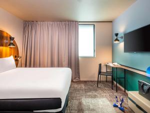 ibis Styles Paris Meteor Avenue d'Italie客房内的一张或多张床位