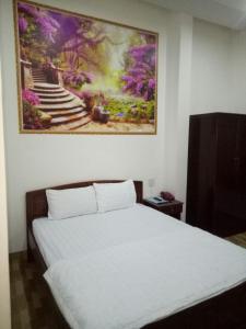 Manh Phat Guesthouse - Nhà Nghỉ Mạnh Phát客房内的一张或多张床位