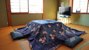 Minpaku Hanaya客房内的一张或多张床位