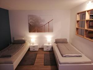 Apartment Heddesheim客房内的一张或多张床位