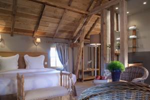 Auberge de la Source - Hôtel de Charme, Collection Saint-Siméon客房内的一张或多张床位