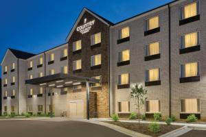 格林斯伯勒Country Inn & Suites by Radisson, Greensboro, NC的酒店前方的图片