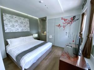 Bliss Hotel Singapore客房内的一张或多张床位