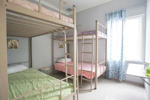INNI Homestay客房内的一张或多张床位