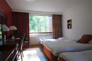 伊苏瓦里肯纳芬兰酒店客房内的一张或多张床位