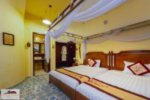 沙非大叻酒店客房内的一张或多张床位