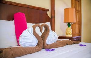 湾景生态水疗度假酒店客房内的一张或多张床位