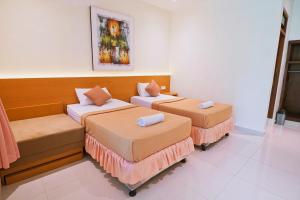 纱丽巴厘岛别墅酒店客房内的一张或多张床位