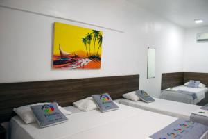 Pousada Arco Iris Fortaleza客房内的一张或多张床位