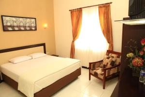 Arya Graha Semarang客房内的一张或多张床位