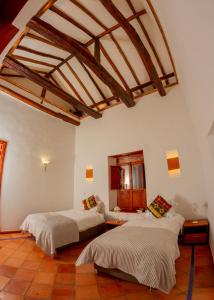 Hotel Marquesa de Pinares客房内的一张或多张床位
