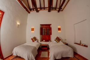 Hotel Marquesa de Pinares客房内的一张或多张床位