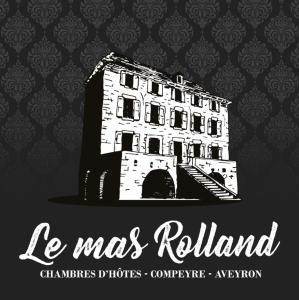 孔佩尔Le mas ROLLAND - Piscine & SPA - MILLAU-GORGES du TARN的墙上建筑物的图画