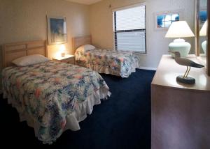 Cape Winds Resort客房内的一张或多张床位