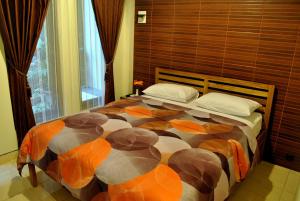 日惹阿罗哈酒店客房内的一张或多张床位