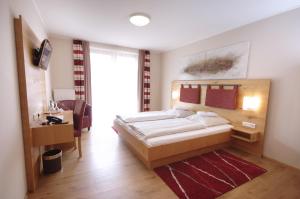 Da`Sporrer Hotel & Wirtshaus客房内的一张或多张床位