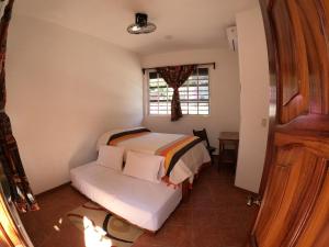 Casa Lomas del Marinero Internet Starlink SIN GARAJE客房内的一张或多张床位