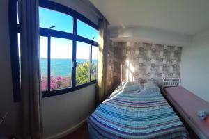 Hospedagem Praia da Costa客房内的一张或多张床位