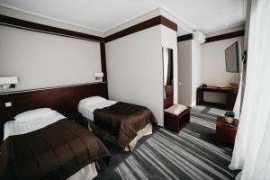 Cruise Hotel客房内的一张或多张床位