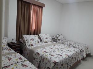 Hotel Morada do Mar客房内的一张或多张床位