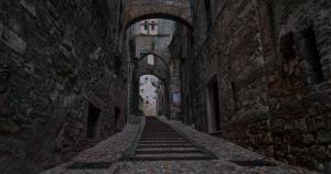 纳尔尼Asso Residence Narni的老石头建筑中一条带楼梯的小巷