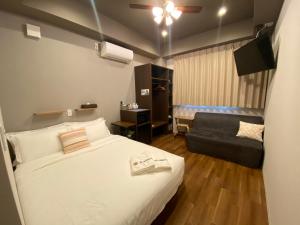 Kainoa Guesthouse客房内的一张或多张床位