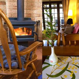 曼吉马普三叶草小屋乡村度假酒店的带壁炉的客厅配有摇椅