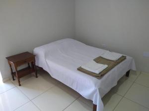 Pousada Sol de Minas客房内的一张或多张床位