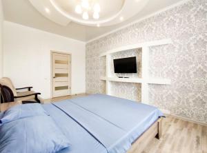 Apartament on Baisheva 7k4客房内的一张或多张床位