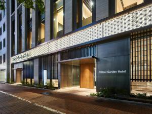 东京Mitsui Garden Hotel Ginza-gochome的一座拥有心理中心酒店入口的建筑