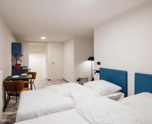 ROXI Residence Gent客房内的一张或多张床位