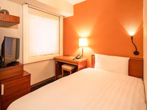 东京六本木舒适酒店(Comfort Inn Tokyo Roppongi)客房内的一张或多张床位