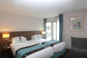 巴黎蒙马特智选假日酒店客房内的一张或多张床位