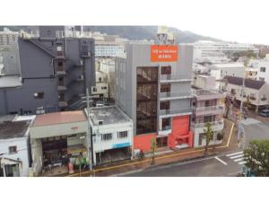 德岛Self inn Tokushima kuramoto ekimae - Vacation STAY 19502v的城市的顶部景观,建筑