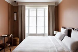 Hotel Rochechouart - Orso Hotels客房内的一张或多张床位