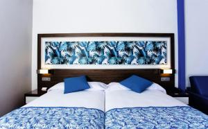 Riu Santa Fe - All Inclusive客房内的一张或多张床位