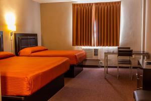 BONITTO INN® Tampico Lomas客房内的一张或多张床位