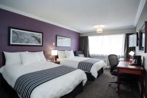 桑德曼威廉斯湖套房酒店客房内的一张或多张床位