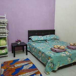 D'Q Putra Homestay Melaka (Unit AMAR)客房内的一张或多张床位