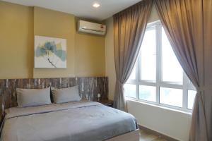 PM Octagon Ipoh Suites & Apartment 3客房内的一张或多张床位