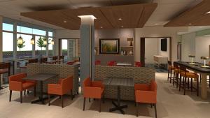 吉尔伯特Holiday Inn Express & Suites - Gilbert - Mesa Gateway Airport的餐厅内带桌椅的大堂