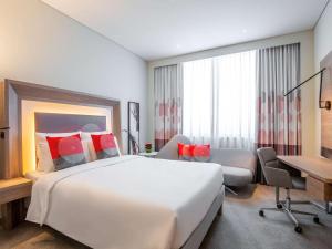 Novotel Bur Dubai - Healthcare City客房内的一张或多张床位