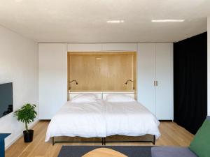 Grüezi Laax Apartments客房内的一张或多张床位