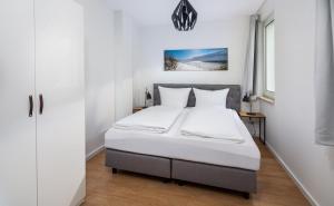 Strandloft Drei Norderney客房内的一张或多张床位
