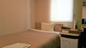 Meet Inn Narita客房内的一张或多张床位