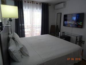 卡洛斯三世酒店客房内的一张或多张床位