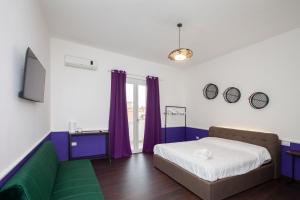 Myrtus Guest House Cagliari客房内的一张或多张床位